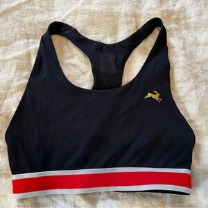 Tracksmith Black Sports Bra with Red and Gold Details